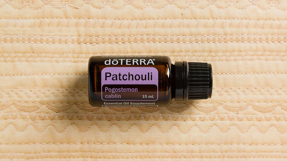 Patchouli oil bottle. A member of the mint family, Patchouli is known to help with skin imperfections, while also providing a grounding, balancing effect on emotions.