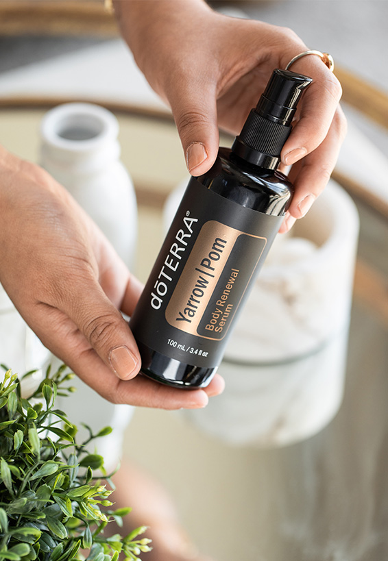 Image of a hand holding the Yarrow|Pom Body Renewal Serum