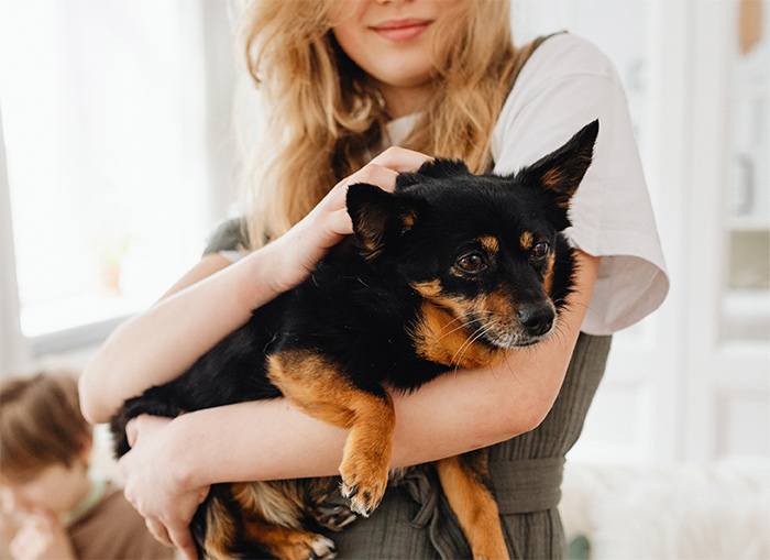 Woman holding her dog