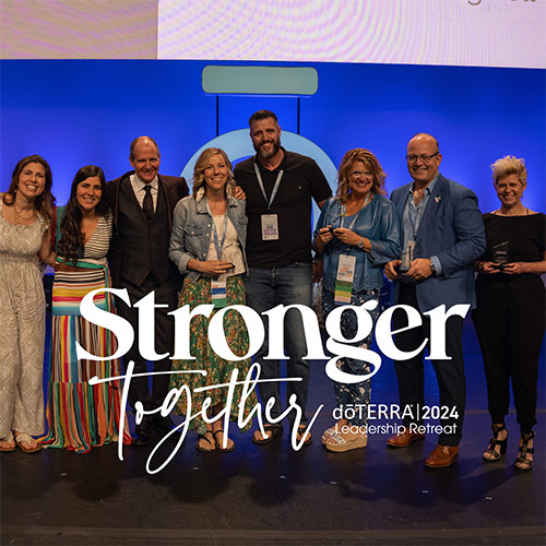 People hugging sideways on the stage