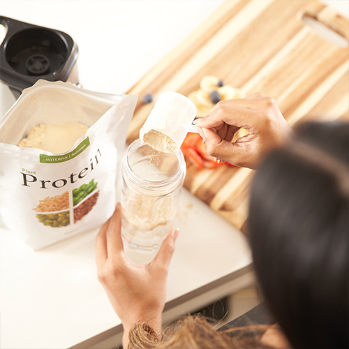 Woman making a doTERRA Protein shake