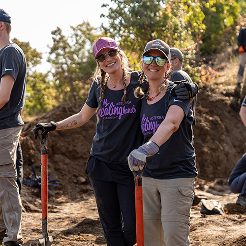 Two women working on a service project