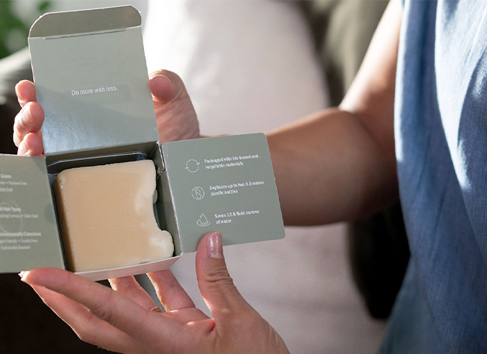 woman holding a hair conditioner bar